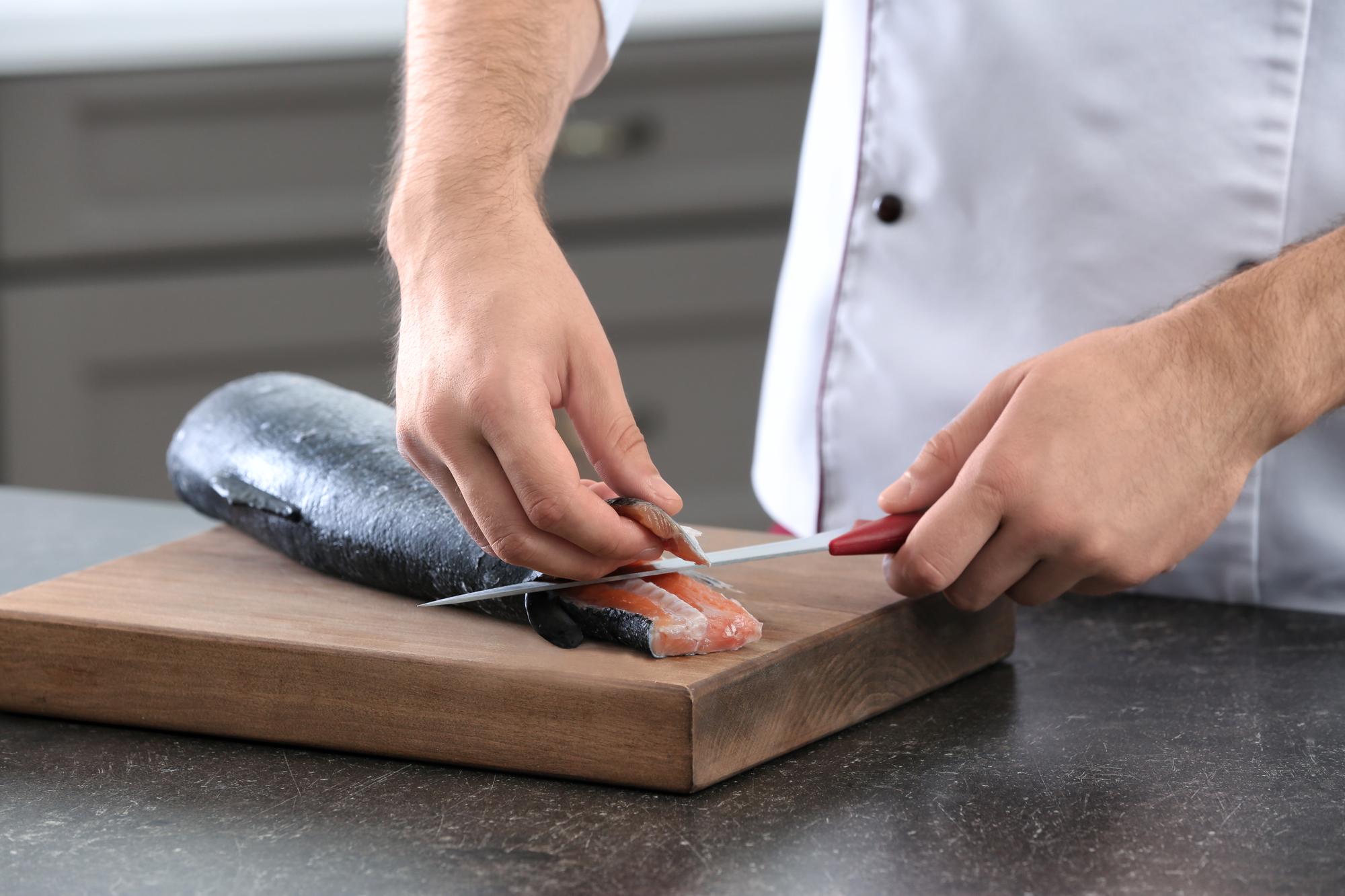 Close-up of hands preparing ingredients with precision